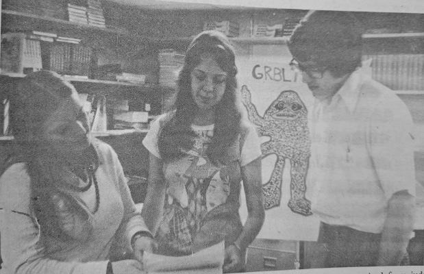 Speech instructor Carolyn Kollmeier, left, looks at critiques received from judges during the LVC speech contest. Cindy Dubry and Steve Axtell, both recipients of Superior ratings at the contest, look on.
