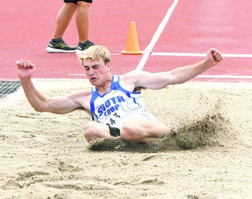 Ethan Furne had the best long jump of his high school career at the Nebraska State Track &amp; Field Championships last weekend in Omaha. Here he leaped 22' 6' to win the Class C silver medal, and set a new school record. (Leader photo by Leta Connell)