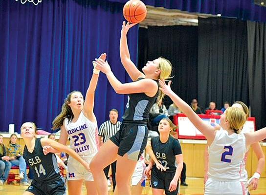Senior Taylor Ross shoots for two during Friday's game at Medicine Valley.