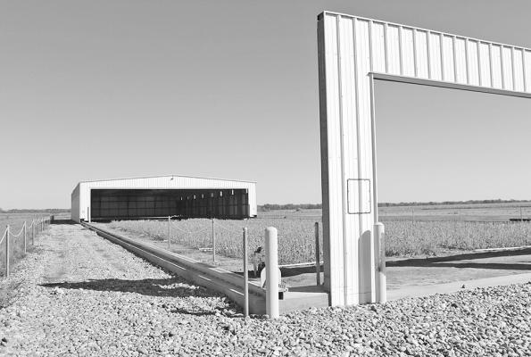The rainout shelter at the Bayer Learning Center is a building on rails that automatically closes over crops when it senses rainfall. This ensures that plots receive only scheduled irrigation. This year’s research under the shelter focuses on soybeans