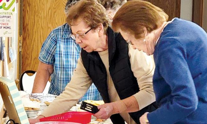 Volunteers help put out desserts at the annual Community Thanksgiving Dinner in Callaway - now in its 10th year. (Courtesy photo)
