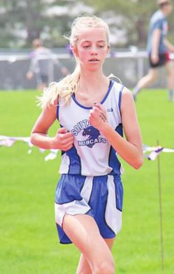 Ella Cool pushes through the last lap of the 3200 meter run at the District C-8 track meet on Thursday at Southern Valley to finish first with a time of 14:16.39 and qualify for state.