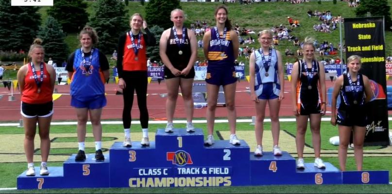 Abby Stallbaumer enjoys her moment on the medals stand after her fourth-place performance in the discus.