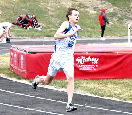 ABOVE: Bryn Schwarz hands off to Asa Starr in the 4x100 meter relay where South Loup brought home 4th place. LEFT: Bryn Schwarz competed in the pole vault and earned a 4th place finish. FAR LEFT: Dylan Pandorf gains momentum to finish a strong 4th (55.81) in the 400 meter dash on a chilly Thursday.