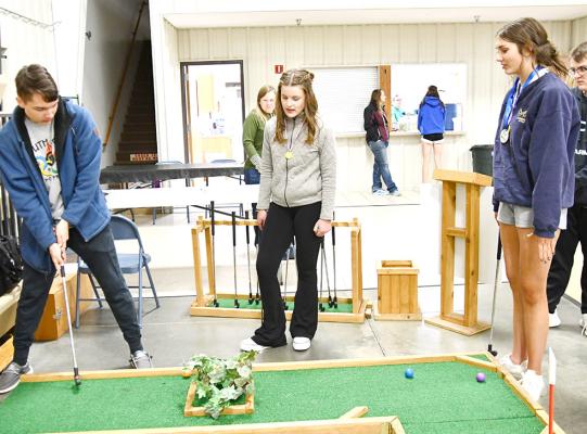 ABOVE: Putt-putt golf is always a favorite recreational activity, and was a hit at the South Loup After-Prom party on April 20.