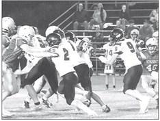 Our Bobcat offensive including #25 Malachi Neth, #9 Paxton Bierman, #2 Elijah Cool, and #8 Carter Wood work together for a good gain by ball carrier #11 Dylan Pandorf. (Courier photo by Loleta Connell)