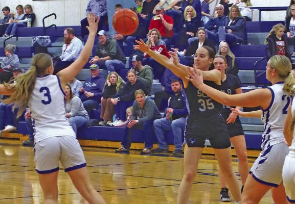 South Loup’s Kaygan Witthuhn passes the ball to a teammate during the final game of the Lady Bobcats’ 2025-26 season last week.