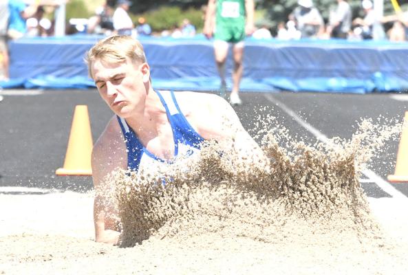 ABOVE: Logan Recoy rounds the corner in the men's 800m run at the state track and field meet in Omaha this past weekend. RIGHT: Ethan Furne kicks up the sand as he lands in the men's state long jump. (Courier photos by Loleta Connell)