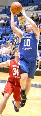 ABOVE LEFT: Cache Gracey lays it in off the glass ending the game with 31 points in All-Star action on June 2. ABOVE RIGHT: Trey Connell goes up for the layup and adds two for the Blue Team on Sunday evening. (Courier photos by Loleta Connell)