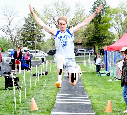 RIGHT: Ethan Furne's leap of 20' 9.5' in the long jump qualifies him for the chance to compete in Omaha.