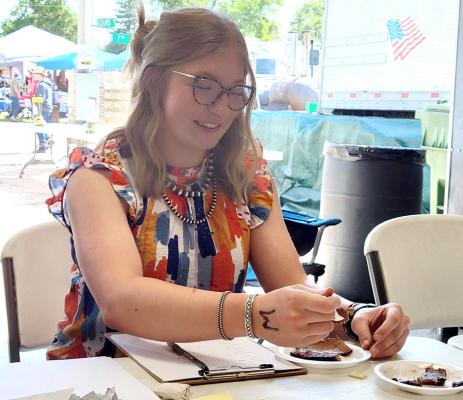 RIGHT: Abby Stallbaumer enjoyed her first time of judging the Oconto BBQ, and was lucky enough to draw her favorite category - brisket. She said she would happily judge again if given the opportunity! (Courier photos by Ellen Mortensen)