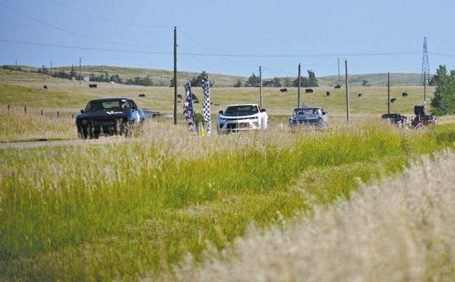 A line of race cars comes back across the hills, returning from the first round of the half-mile and one-mile shootout. (Photos courtesy Jessica Tickle)