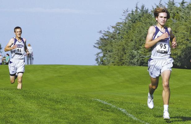 ABOVE: Josiah Coleman and Walter Bierman run the course at the Broken Bow Invitational cross country meet last Saturday, where both runners medaled.