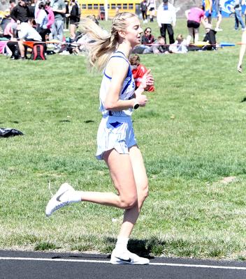 ABOVE LEFT: Freshman Elijah Cool brought home 5th place in the 800m dash at the Burwell Invite last week with a time of 2:16.80. ABOVE RIGHT: Junior Ella Cool won gold in the 3200m run at Burwell crossing the finish line at 13:37.64. (Courier photos by Loleta Connell)