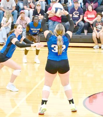 RIGHT: Riata Remund sets the ball for Aubrie Birkel. (Photo courtesy Jessica Tickle)