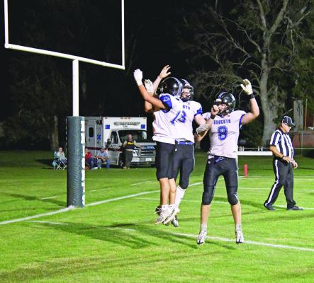 Courier photo by Loleta Connell The Bobcats celebrate together in the endzone after a hard earned touchdown Thursday evening on the road at Dunning.