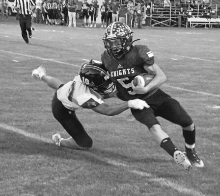Courier photos by Loleta Connell LEFT: Freshman #44 Crew Witthuhn is down and ready against a strong Knight front. BELOW: Quarterback #3 Trey Connell calls for the snap and this handoff goes #20 AJ Starr's way in the Bobcats 22-32 loss to the Knights. ABOVE: #10 Freshman Conner Paulsen tracks down the Knights ball carrier #5 Sophomore Kyle Cox in action Thursday evening at Dunning.