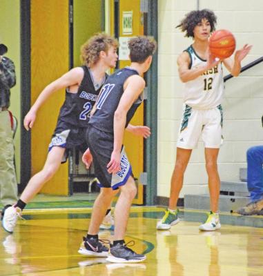 Kaden Paulson and Harper Johnson read a pass by NPSP’s Zarek Branch. (Courier Photos by Loleta Connell)