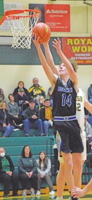 Cache Gracey takes the ball up against NPSP defenders on Feb. 22 during subdistrict action.