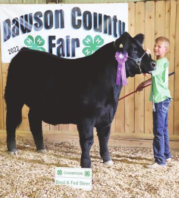 Dylanger Schledewitz, Oconto, took home the Champion Bred &amp; Fed Steer trophy and rosette during the Beef Show. Dylanger also captured the junior beef showmanship trophy.