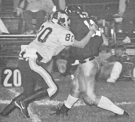 This photo appeared in the Oct. 20, 2005, issue of the Courier. Senior Zach Meyer (#80) gets to Maxwell quarterback Jon Hofer for an 11-yard sack