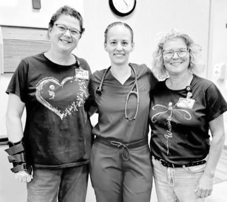 ABOVE: From left, Janel Brestel, Dr. Chelsea Williams, and Kelly Herbig pose for a photo during the SLS Awareness Walk. LEFT: Community members Ken Pitkin, Jill Pitkin, and Karla Pandorf took some time on Sept. 18 to show their support for suicide awareness while catching up with friends and neighbors during the SLS Awareness Walk. (Photos courtesy Senior Life Solutions)