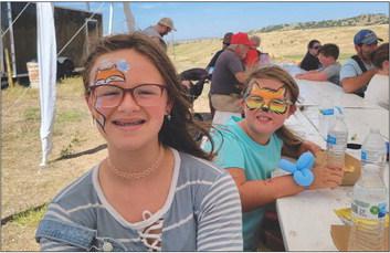 There were other activities at the field over the weekend other than kite flying. Veva Tickle, left, and Zuella Tickle of Arnold took advantage of the face painting in the large tent.