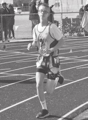 Caleb McFate competes in the mile at the St. Pat's Invite March 26. (Courier photo by Loleta Connell)