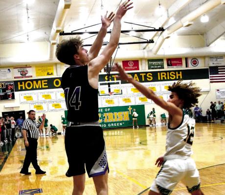 #14 Junior Cache Gracey pulls from outside over St. Pat's defender #12 Senior Zarek Branch in the Bobcats 69-52 loss to the #1 ranked Irish. (Courier photos by Loleta Connel)