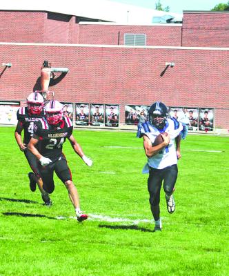 South Loup's Dylan Pandorf gets to the outside to gain extra yardage in last week's game against Perkins County. Pandorf rushed for 52 yards and threw for 105 yards last week against the Plainsmen. (Courier photo by Melissa Eggleston)