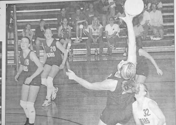 Senior Katie Fortin goes airborne to slow a Stapleton attack for teammates, l-r, Kimberly Pierce, Whitney Jenkins and Traci Pandorf.