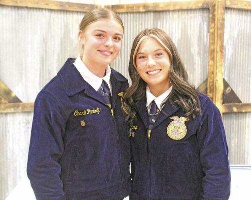 Earning the State Degree, the highest honor for an FFA member, are Charli Pandorf, left, and Addison Stump. At the end of the evening, the two were also announced as officers for next year, with Pandorf as president and Stump as vice president. (Courier photo by Ellen Mortensen)