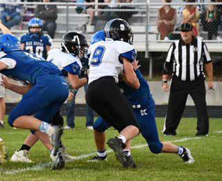 #9 Sophomore Jamie Tickle and #1 Freshman Zane Ellison put a big block on #30 Maddox Wagoner