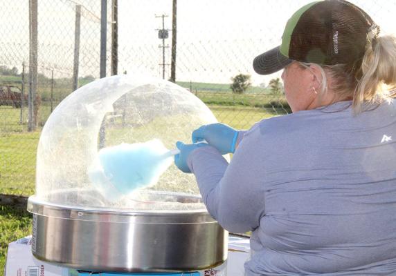 Above: Free cotton candy was handed out to the kiddos during the celebration at the ball field in Callaway on July 4. (Courier photos by Ellen Mortensen) Left: Members of the Phelps family are front row, from left: Lana Phelps, Lindsey Phelps, Susan Phelps and Julie Sybrant; back row: Josie Phelps, Jim Phelps, Mark Phelps and Chad Sybrant. The Phelps family provides the wonderful fireworks display each year.