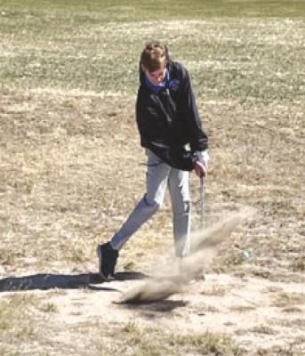 Brady Brestel chips his ball out of the sand on April 11 at Arnold Country Club during the South Loup Invitational. Coach Rush says he's impressed with Brestel's improvement. (Photo courtesy of Jarod Rush)