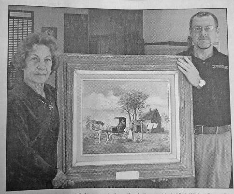 Local artist Mariel Klingbeil presents her oil painting entitled “Visit With a Doctor” to Callaway District Hospital. Hospital Administrator Marvin Neth accepted the gift.