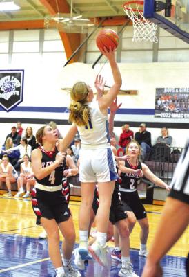 Abby Stallbaumer makes a shot during Tuesday night's win against Loup City. (Courier photo by Patti Schwarz)