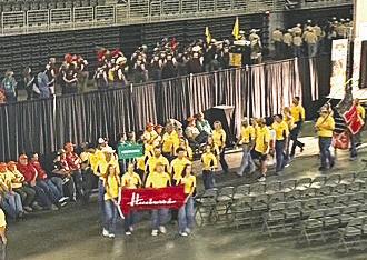 As the teams entered the auditorium for the opening ceremony of the national shooting competition, the three members of the South Loup Club had the privilege of carrying the Husker flag and the Nebraska sign. The girls all said they considered it an honor to represent their state.