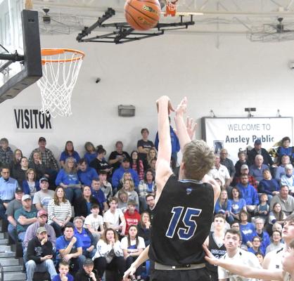 Junior Carter Wood shoots and adds two more for the Bobcats in the District final against Ansley/Litchfield. (Courier photos by Loleta Connell)