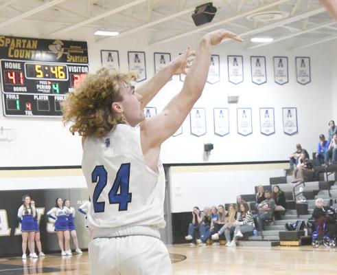 Junior Harper Johnson fires from the outside in the Bobcats first round Sub-District 53-39 victory over the Mavericks.