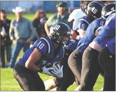 Conner Paulsen follows his offensive line to gain good yards in the Bobcats 48-34 win over the Knights.