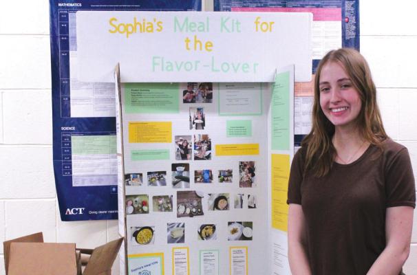 Sophia Doyle will have to take apart her display board and reassemble it when she arrives in San Diego for National FCCLA. (Courier photo by Ellen Mortensen)