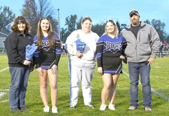 ABOVE: The two senior Bobcats cheerleaders and their parents were honored during Friday night's game in Callaway. From left are Kristin Bailey, Addison Bailey, Crystal Hanna, Taylor Hanna and Michael Hanna. (Courier photo by Loleta Connell)