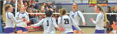 The Lady Bobcats celebrate a point during play in Friday night's game vs. S/T as Josie Reiff hits one from the back row. (Photos courtesy Patti Schwarz)