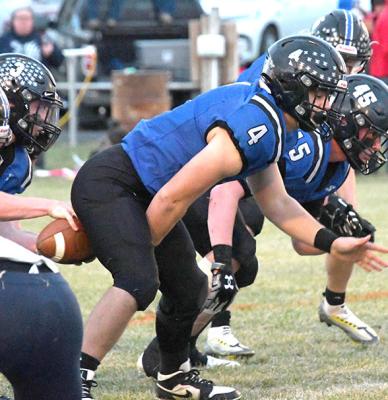Dawson Doggett (#4) snaps the ball to quarterback, Trey Connell, in the Bobcats' win.