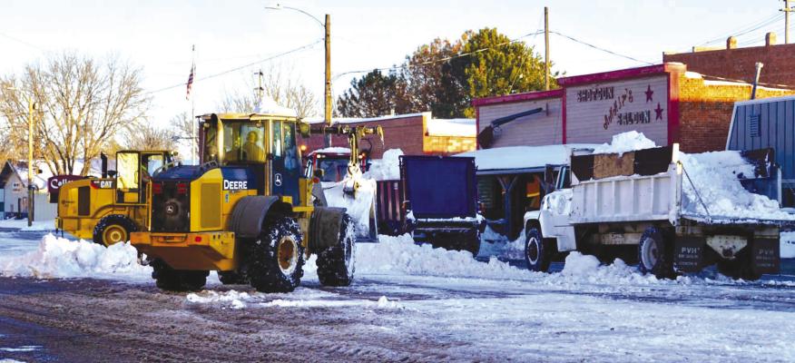 Callaway residents came to the aid of the Village street crew to help clear the nearly 2-feet of snow that fell on Wednesday, Jan. 18. The storm canceled school for two days, as well as several school-related and community activities. (Photo courtesy Janel Brestel)