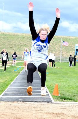 RIGHT: Josie Reiff placed 7th in the long jump with a leap of 13'11' as the day was cut short due to lightning and a thunderstorm setting in at Overton on April 16. (Courier photo by Loleta Connell)