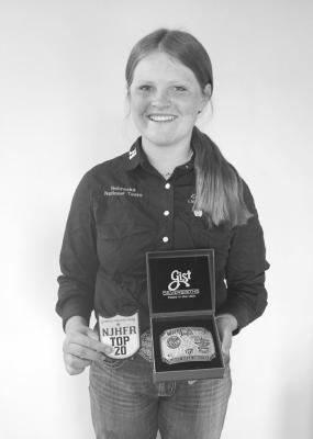 Shown is Karsyn Chesley, 14, of Harrisburg with the belt buckle she recently earned by finishing 7th in the nation at the Jr Hi National Rodeo Finals in the Light Rifle shooting competition in Des Moines, Iowa. Karsyn won the Nebraska State Championship and competed with 130 contestants at the national level. She is the daughter of Dan and Heidi Chesley and granddaughter of Dave and Jo Chesley of Callaway. (Photo courtesy Jo Chesley)
