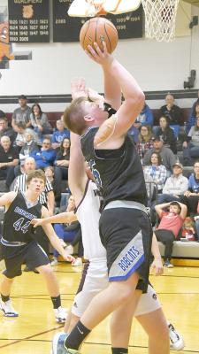 Senior Joey Sallach delivers underneath against Twin Loup Friday evening, Dec. 1, in Sargent. (Courier photos by Loleta Connell)
