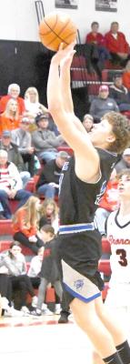 Left: Sophomore Crew Witthuhn shoots from up top in the Bobcats contest Saturday, Dec. 2, against Amherst.